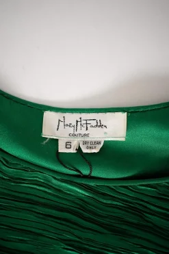 Green lame pleated midi dress with leg-of-mutton sleeves