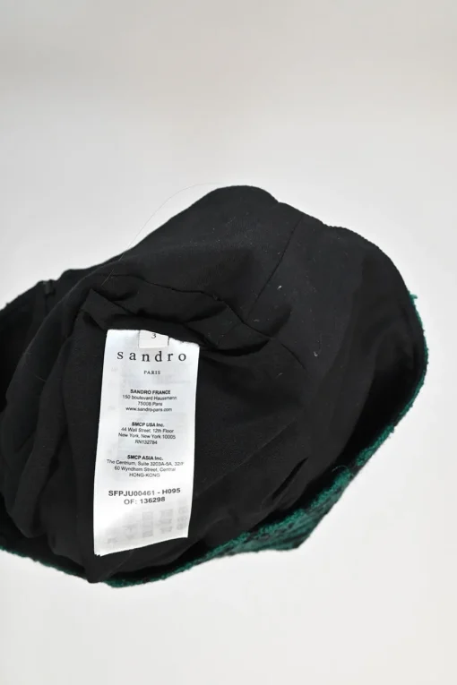 Green polyester-wool-blend houndstooth tweed mini skirt with contrast piping details