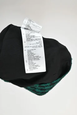 Green polyester-wool-blend houndstooth tweed mini skirt with contrast piping details