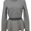 Grey and blush wool textured jacquard knit long sleeve peplum top with ribbed waistband