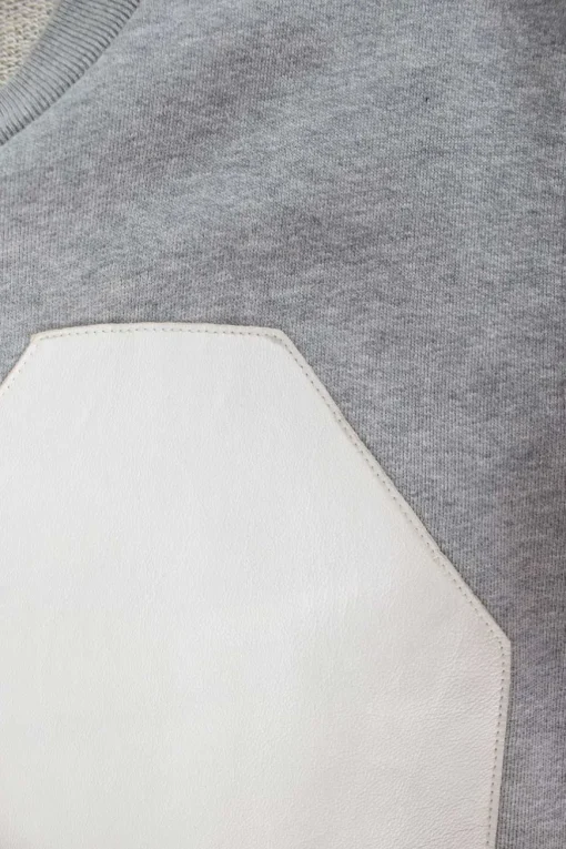 Grey sleeveless top with white leather patches