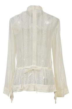 Iconic Milk viscose lace shirtwaist-style high-collar peek-a-boo peplum blouse with ribbon-tie fastening at waist
