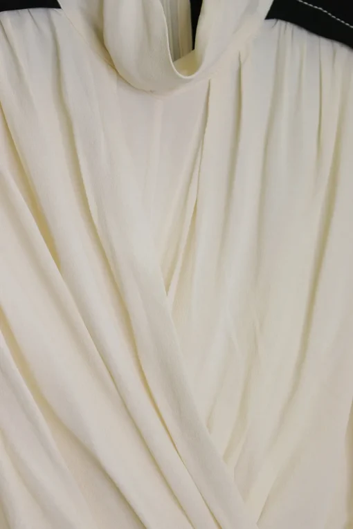 Ivory and black viscose high neck draped tie-waist midi dress with bishop sleeves and handkerchief hem
