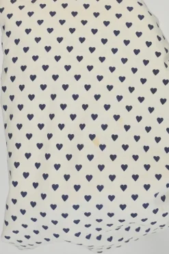 Ivory and navy cotton novelty heart print half-button pullover long sleeve polo top