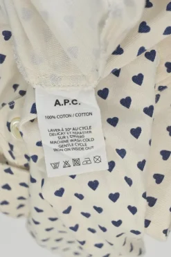 Ivory and navy cotton novelty heart print half-button pullover long sleeve polo top