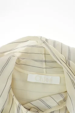 Ivory and navy striped cotton poplin puff sleeve pussy-bow blouse
