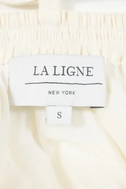 Ivory bias-cut linen-blend plunge neck flutter sleeve tiered maxi dress with open back and ribbon-tie fastening at nape
