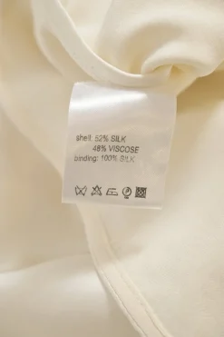 Ivory bias-cut silk-blend cowl neck dolman sleeve blouse