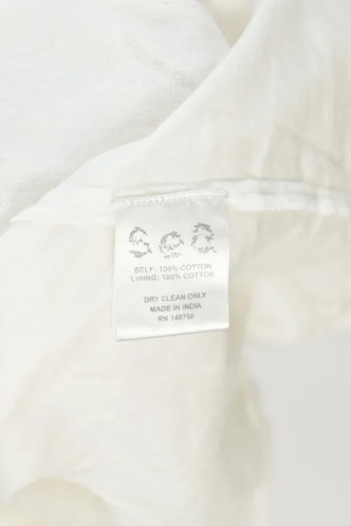 Ivory cotton broderie Anglaise ruffled high-collar sleeveless swing dress with tonal lace inserts