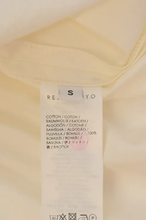 Ivory cotton button-front shirt with detachable sailor-style ruffled Bertha collar