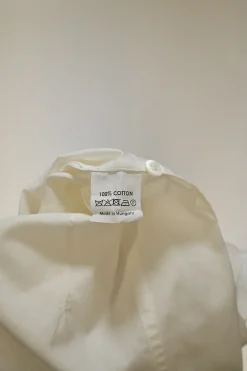 Ivory cotton poplin dagger collar button-front cinched waist sleeveless shirt dress