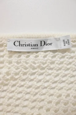 Ivory cotton-blend crochet knit tie-neck keyhole-front tennis-style midi dress with cinched waist and pleated skirt