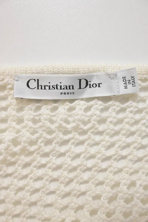 Ivory cotton-blend crochet knit tie-neck keyhole-front tennis-style midi dress with cinched waist and pleated skirt