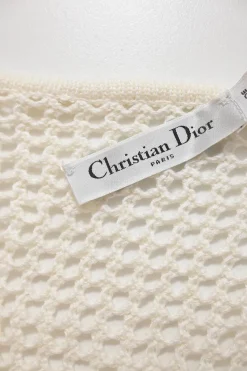 Ivory cotton-blend crochet knit tie-neck keyhole-front tennis-style midi dress with cinched waist and pleated skirt