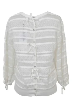 Ivory cotton-blend lace paneled peek-a-boo pullover Y-collar top with enamel Coco Mark shank button back