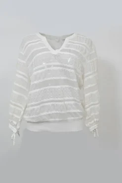 Ivory cotton-blend lace paneled peek-a-boo pullover Y-collar top with enamel Coco Mark shank button back