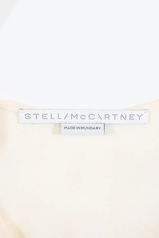 Ivory crepe round neck tie-waist blouson with concealed placket