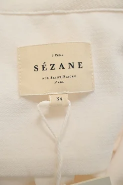 Ivory draped polyester stand collar wrap-effect blouson sleeve top