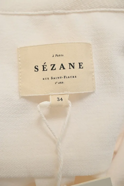 Ivory draped polyester stand collar wrap-effect blouson sleeve top