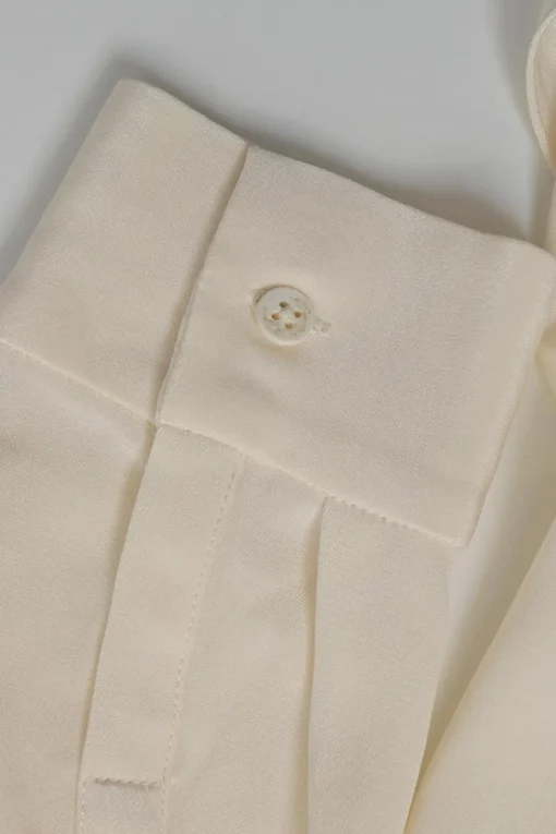 Ivory draped silk stand collar wrap-effect plunge neck blouse with high-low hem