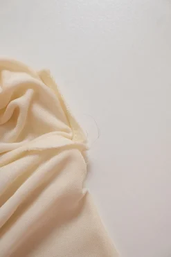 Ivory draped viscose plunge back tunic blouse
