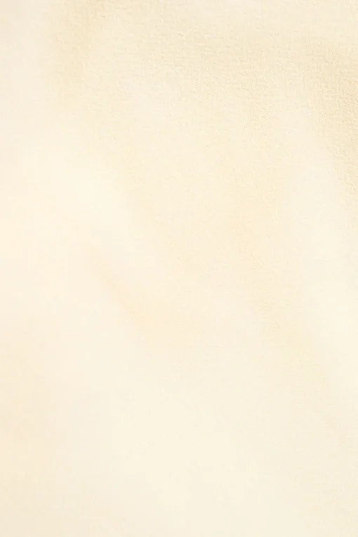 Ivory draped wool crepe cowl-neck asymmetric sleeveless top with back tie