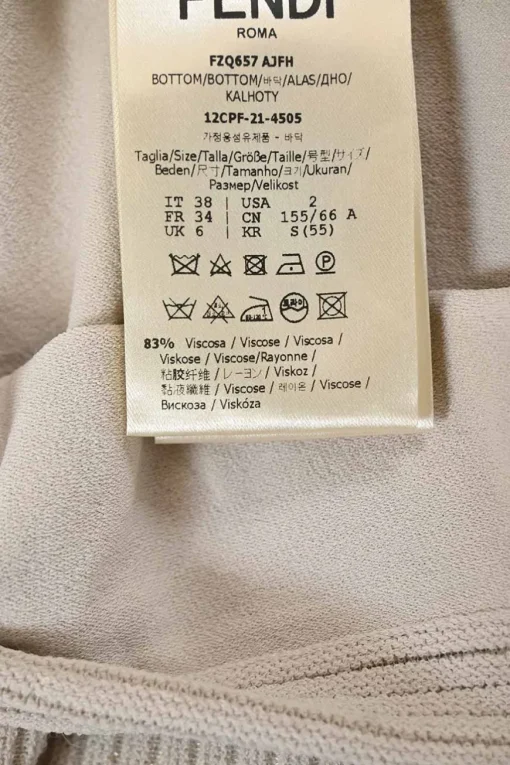 Ivory fully-fashioned viscose-blend peek-a-boo drop-waist midi skirt