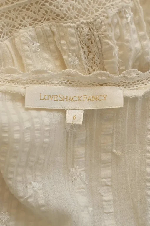 Ivory lace-trimmed cotton seersucker Edwardian combination-style puff sleeve button-front tiered midi dress