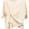 Ivory merino wool and cashmere-blend knit V-neck dolman sleeve gathered sweater with gold-finish motif