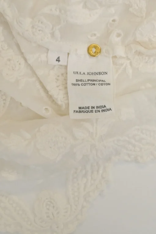 Ivory paisley-embroidered eyelet cotton half-sleeve scalloped hem blouse with ruffled collar