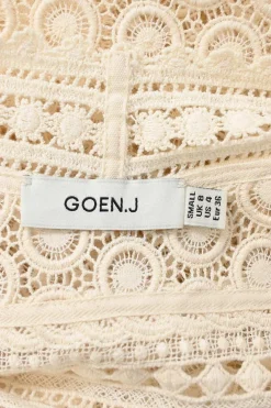 Ivory panelled cotton broderie Anglaise V-neck cami top with adjustable spaghetti straps and scalloped hem