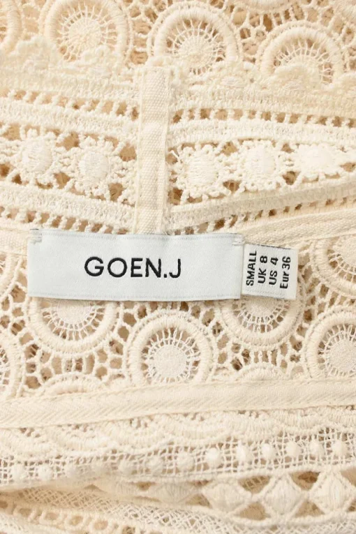 Ivory panelled cotton broderie Anglaise V-neck cami top with adjustable spaghetti straps and scalloped hem