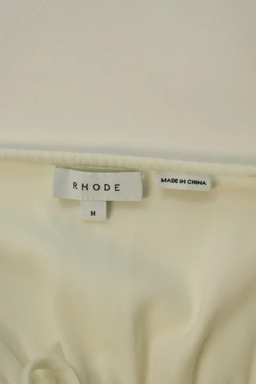 Ivory polyester-blend tie-front ruched off-shoulder peplum blouse