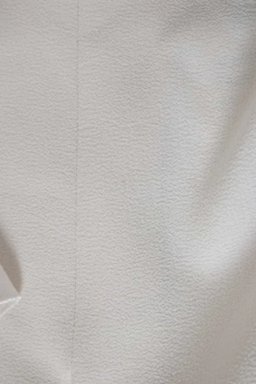 Ivory short ruffled sleeves top with front and side slits