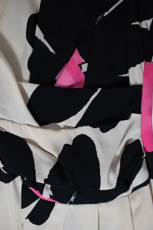 Ivory short-sleeve pleated dress with big black and pink flower pattern