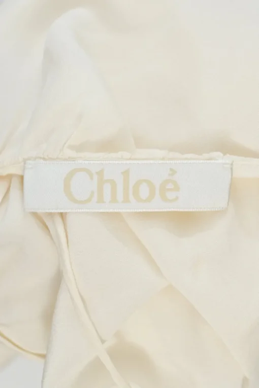 Ivory silk racerback swing-style camisole with fixed spaghetti straps
