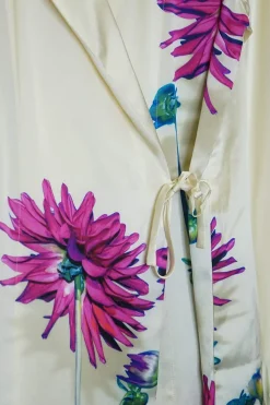 Ivory silk satin floral wrap-front shirt with adjustable self-tie fastening at side