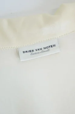 Ivory silk satin floral wrap-front shirt with adjustable self-tie fastening at side