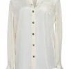 Ivory silk spread collar button-front blouse with chest patch pocket appliqué