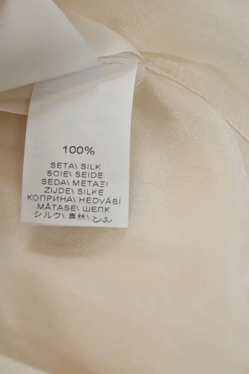 Ivory silk spread collar button-front blouse with chest patch pocket appliqué
