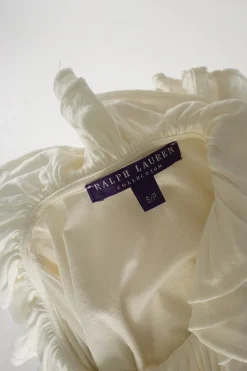 Ivory silk-blend jersey ruffle knit jabot blouse with flounce cuffs
