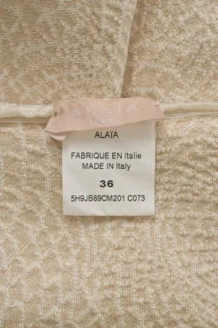 Ivory viscose-blend metallic 3D knit pull-on A-line mini skirt with scalloped hem