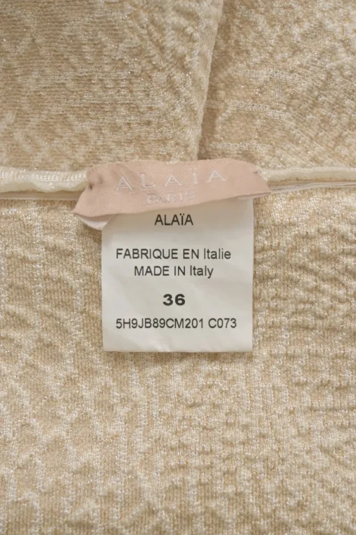 Ivory viscose-blend metallic 3D knit pull-on A-line mini skirt with scalloped hem