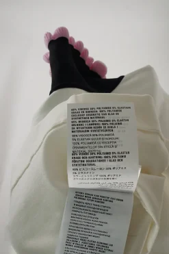 Ivory viscose-blend mini A-line knit polo dress with contrast ruffled rib trim in black and pink