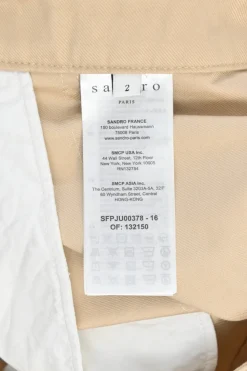 Khaki cotton twill pull-on high-rise ruffled mini skirt with belt loop waistband and rear zip fastening