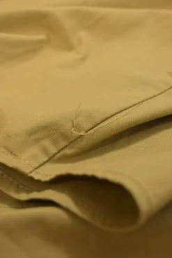 Khaki cotton-blend tie-neck stand collar raglan sleeve blouse with concealed placket