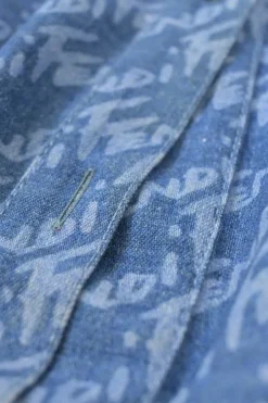 Laser-wash indigo cotton denim spread collar button-front half-sleeve shirt featuring allover brush logo motif