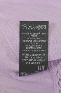 Lilac paneled halter-neck Lisio blouse with cutout edge trim inserts and ruffled hem