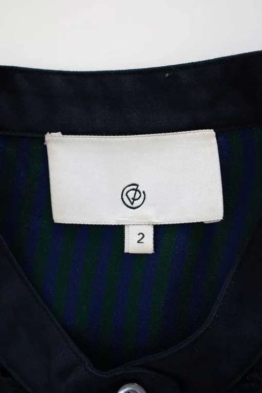 Navy and green cotton-bled mixed media button front sleeveless blouse with fringe trim at hem