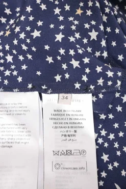Navy bias-cut silk star print long sleeve shirt dress with spread collar and handkerchief skirt